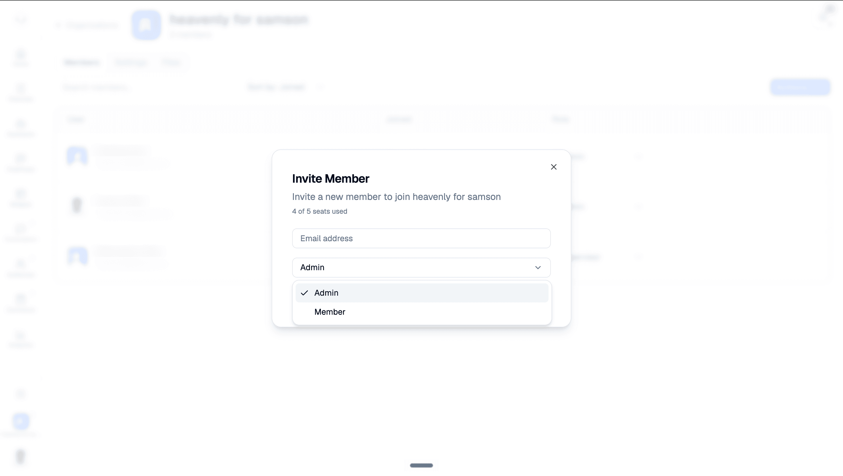 Invite Member dialog with an empty email field, seat usage, and the role dropdown showing Admin and Member; background member names and emails are blurred.